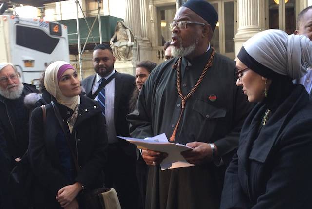 Imam Talib Abdur-Rashid speaks outside court in March.